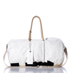The Vintage International 14 Duffel by Sea Bags is crafted from recycled sail cloth and features tan rope handles, a beige shoulder strap, and a white tag labeled Sea Bags. This vintage white duffel is displayed against a white background. by Sea Bags