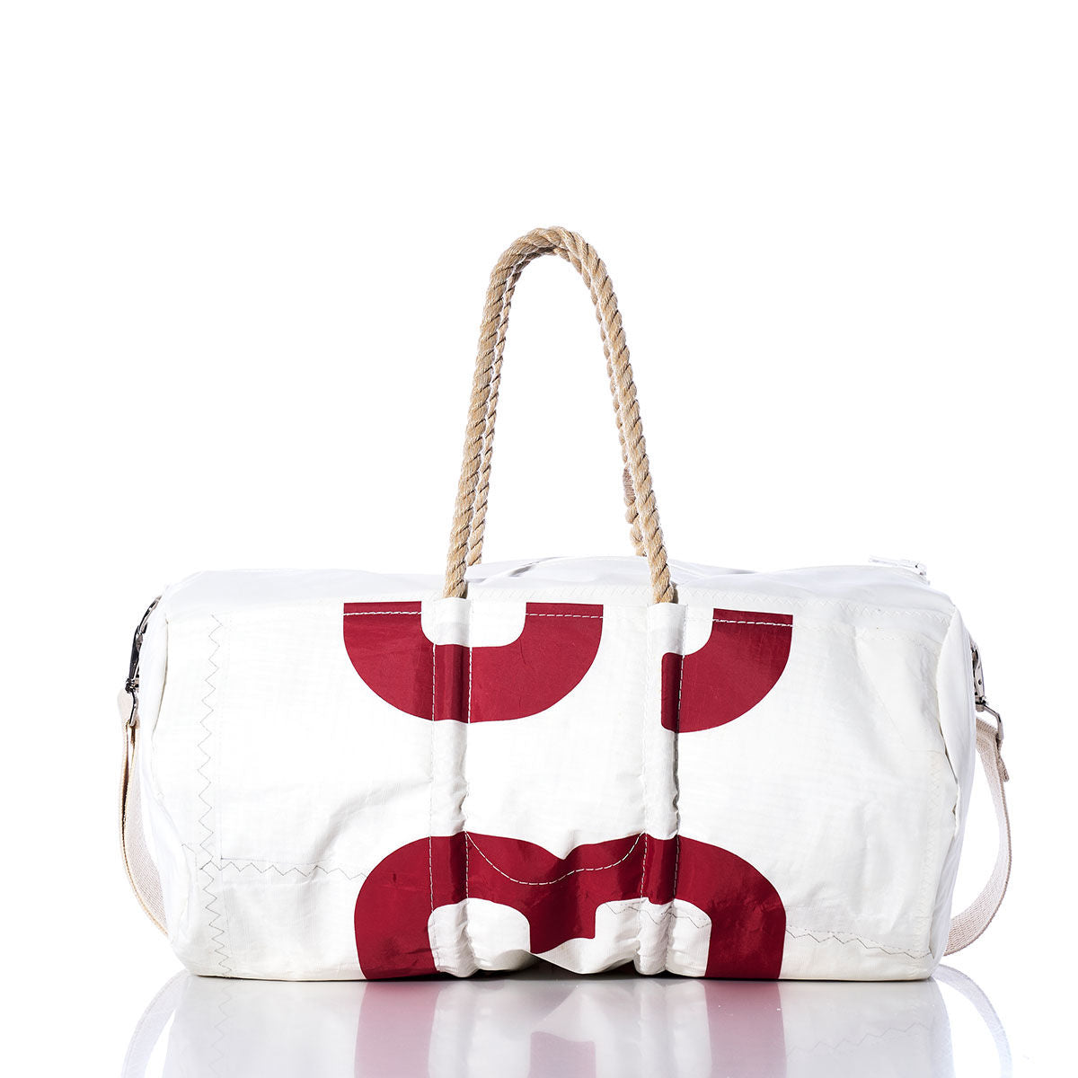 Sea Bags Vintage 539 Duffel, crafted from recycled sail cloth, features red circular patterns, hemp rope handles, and a shoulder strap; shown on a white background. by Sea Bags