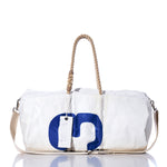 The Sea Bags Vintage 93 Duffel is a white duffel bag made from recycled sail cloth, featuring sturdy beige hemp rope handles, a beige shoulder strap, and a bold blue 93 detail on the front, shown against a white background. by Sea Bags