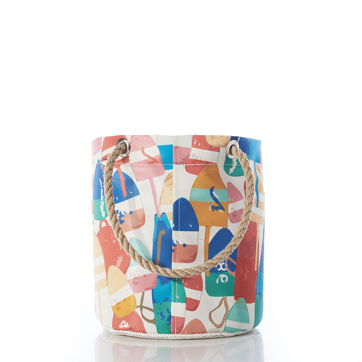 The Sea Bags Downeast Buoys Beachcomber Bucket is a colorful, bucket-style bag featuring abstract summer prints and sturdy rope handles, inspired by recycled sail cloth bags, shown on a white background with reflective highlights beneath. by Sea Bags
