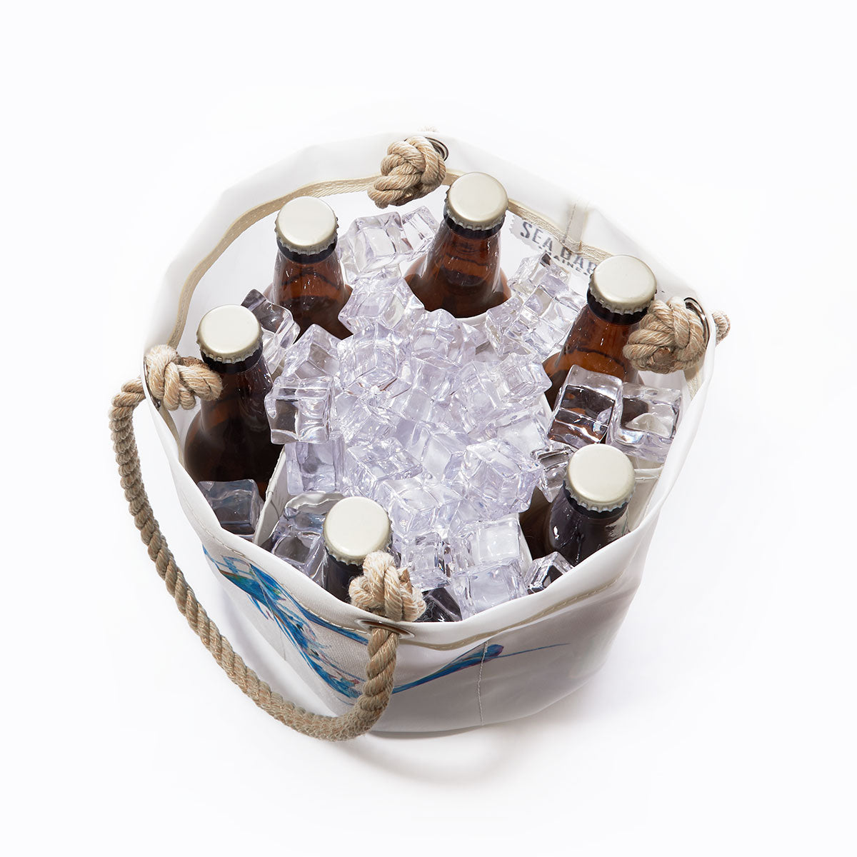 Six bottles on ice in the Sea Bags Multicolor Lobster Beverage Bucket, crafted from recycled sail cloth with rope handles and shown from above against a plain white background. by Sea Bags