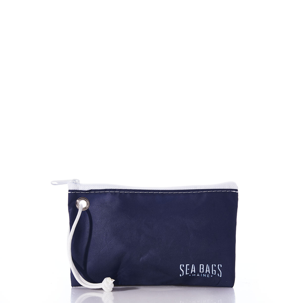 The White-on-Navy Sea Turtle Wristlet by Sea Bags is a small, eco-friendly pouch crafted from recycled sails in navy blue, featuring a zippered closure, a white cord for convenient hands-free carrying, and the SEA BAGS logo in white text on the bottom right corner. Displayed against a white background, this versatile wristlet is both sustainable and stylish. by Sea Bags