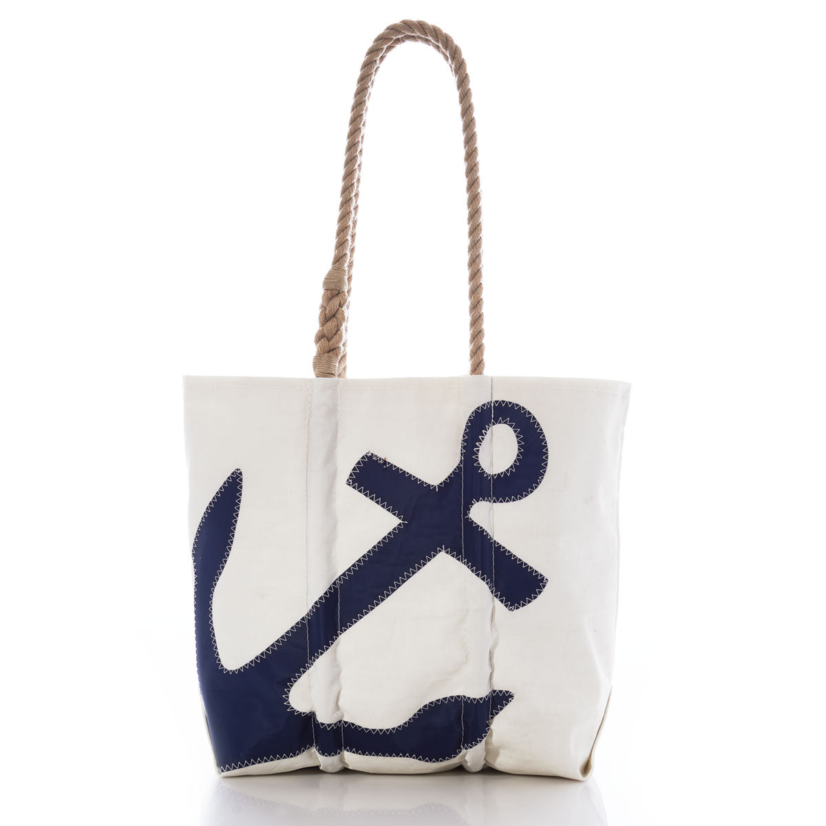 Sea Bags Navy Anchor Medium Tote with Hemp Rope features a white canvas body made from recycled sail bags, tan hemp rope handles, and a bold navy blue anchor graphic on the front. Photographed against a white background, this durable tote blends nautical style with eco-friendly craftsmanship. by Sea Bags