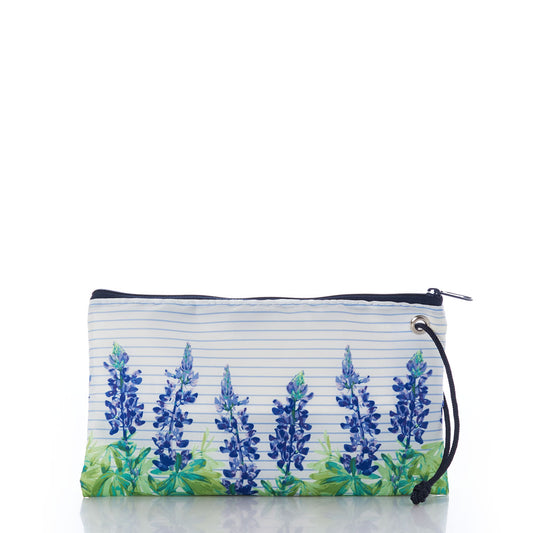 Introducing the Lupine Sailor Stripe Large Wristlet by Sea Bags—a rectangular pouch crafted from recycled sail cloth for coastal charm, featuring a zippered closure, convenient wrist strap, classic striped background, and a blue and green lupine floral design along the bottom. by Sea Bags