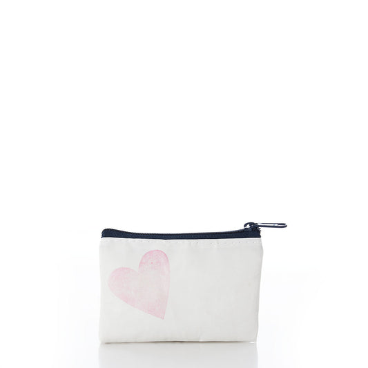 The Sea Bags Heart Everyday Carry Mini Pouch is a small white zippered pouch crafted from recycled sail cloth, featuring a black zipper and a light pink heart graphic on the front. Perfect as a chic coin purse or compact organizer, it is photographed against a white background. by Sea Bags