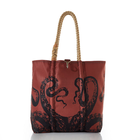 The Sea Bags Tanbark Octopus Medium Tote is a brown tote bag made from recycled sail cloth, featuring sturdy rope handles and a striking black octopus tentacle design on the front. Inspired by classic tanbark bags, it is shown against a white background. by Sea Bags