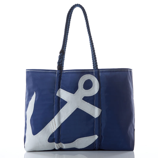The Sea Bags White-on-Navy Anchor Large Tote with Clasp features a bold white anchor design on the front, accented by classic white stitching and finished with two sturdy navy rope handles, creating a stylish and nautical accessory. by Sea Bags
