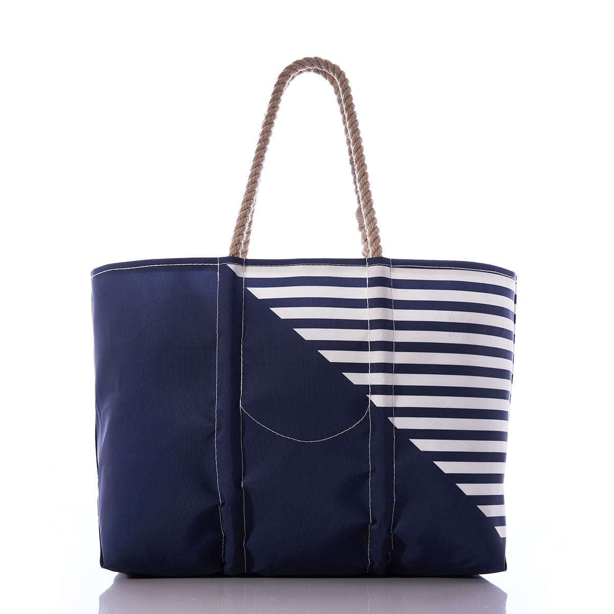 The Breton Stripe White Anchor Large Tote by Sea Bags features classic navy and white diagonal stripes on one side, crafted from recycled sail cloth with durable rope handles, showcased against a white background for an eco-friendly statement. by Sea Bags