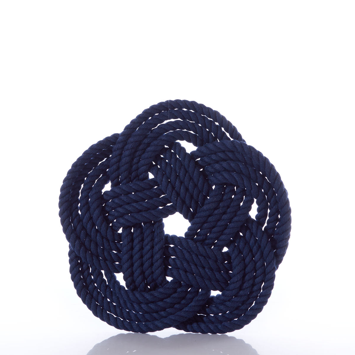 A Nautical Sailor Knot Trivet in navy, expertly crafted by Mystic Knotwork, tied in an intricate decorative knot and displayed against a white background—a stunning showcase of the brand’s craftsmanship.