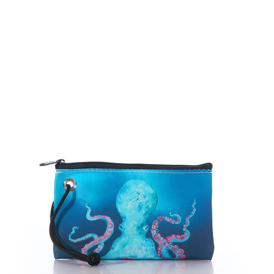 The Sea Bags Multicolor Octopus Wristlet is a small zippered pouch with a wrist strap, crafted from recycled sail cloth. It features a striking illustration of a blue octopus with pink tentacles on a blue background, making it an eco-friendly and stylish wallet alternative. by Sea Bags
