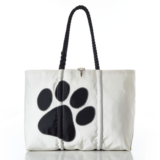 Introducing the Sea Bags Paw Print Large Tote: a white bag featuring sturdy black rope handles and a striking black paw print on the front. Photographed against a clean white background, this versatile tote is perfect for dog lovers and doubles as a fashionable carryall for pet supplies. by Sea Bags