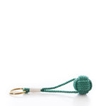 The Monkey’s Fist Keychain-Green by Mystic Knotwork features a classic green knotted rope ball attached to a brass key ring, accented with white cotton cord wrapping for a stylish nautical touch.