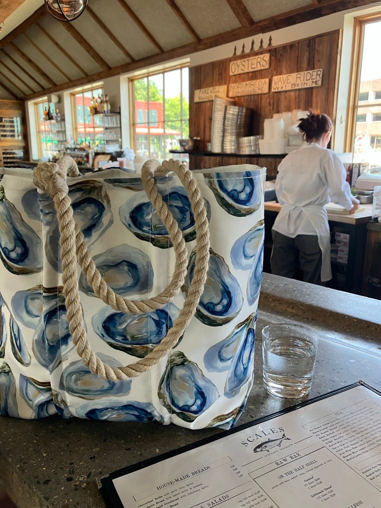 oyster tote bag shown in a portland maine raw bar called Scales