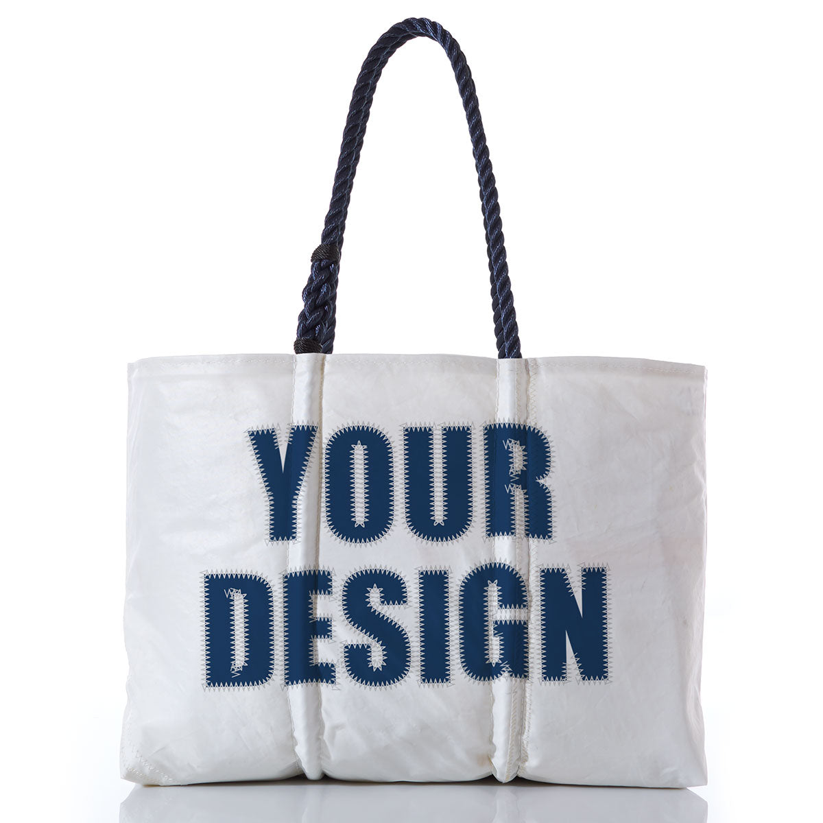 The Sea Bags Custom Design Large Tote features dark braided handles and displays the words YOUR DESIGN in large, bold, blue letters on the front. Photographed against a white background, this personalized tote is ideal for showcasing your creativity or serving as a stylish custom bag for everyday use. by Sea Bags