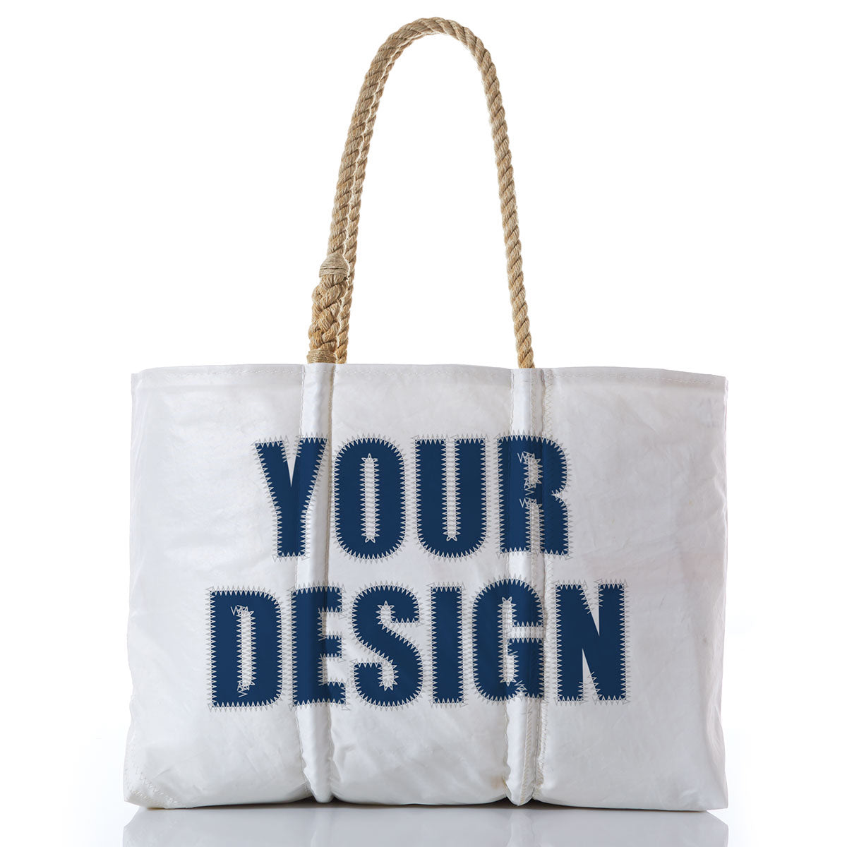 Sea Bags Custom Design Large Tote is shown upright, featuring sturdy rope handles. Made from reclaimed sail bag materials, the front displays YOUR DESIGN in large, bold dark blue letters—an ideal choice for a personalized tote that’s both stylish and eco-friendly. by Sea Bags