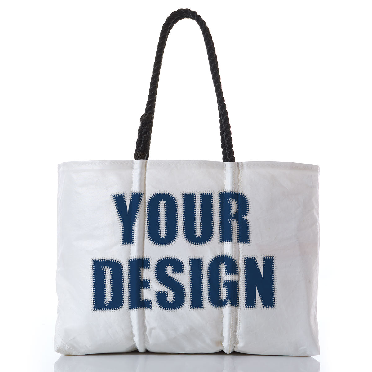 The Sea Bags Custom Design Large Tote features black rope handles and displays “YOUR DESIGN” in bold blue letters across the front. Shown against a white background, this spacious tote is perfect for expressing your unique style while offering practicality and durability. by Sea Bags