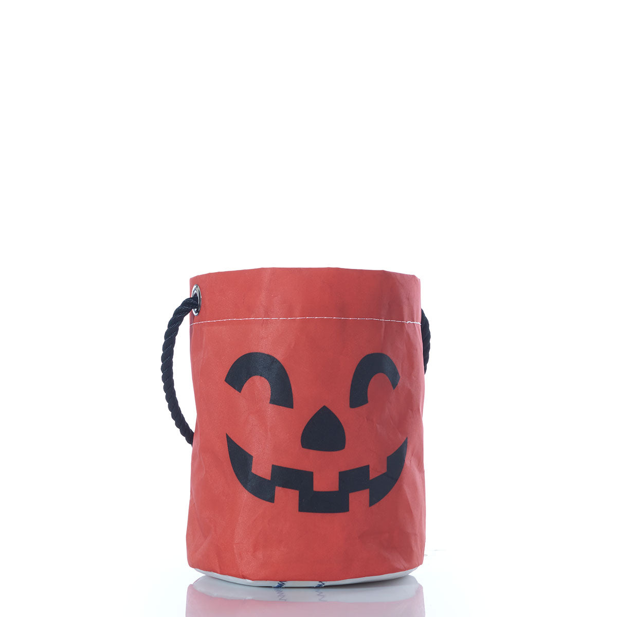 The Sea Bags Jack OLantern Bucket Bag features a classic orange design with a bold black jack-o’-lantern face and a sturdy black rope handle, shown here on a white background—an ideal, reusable choice for collecting Halloween candy year after year. by Sea Bags