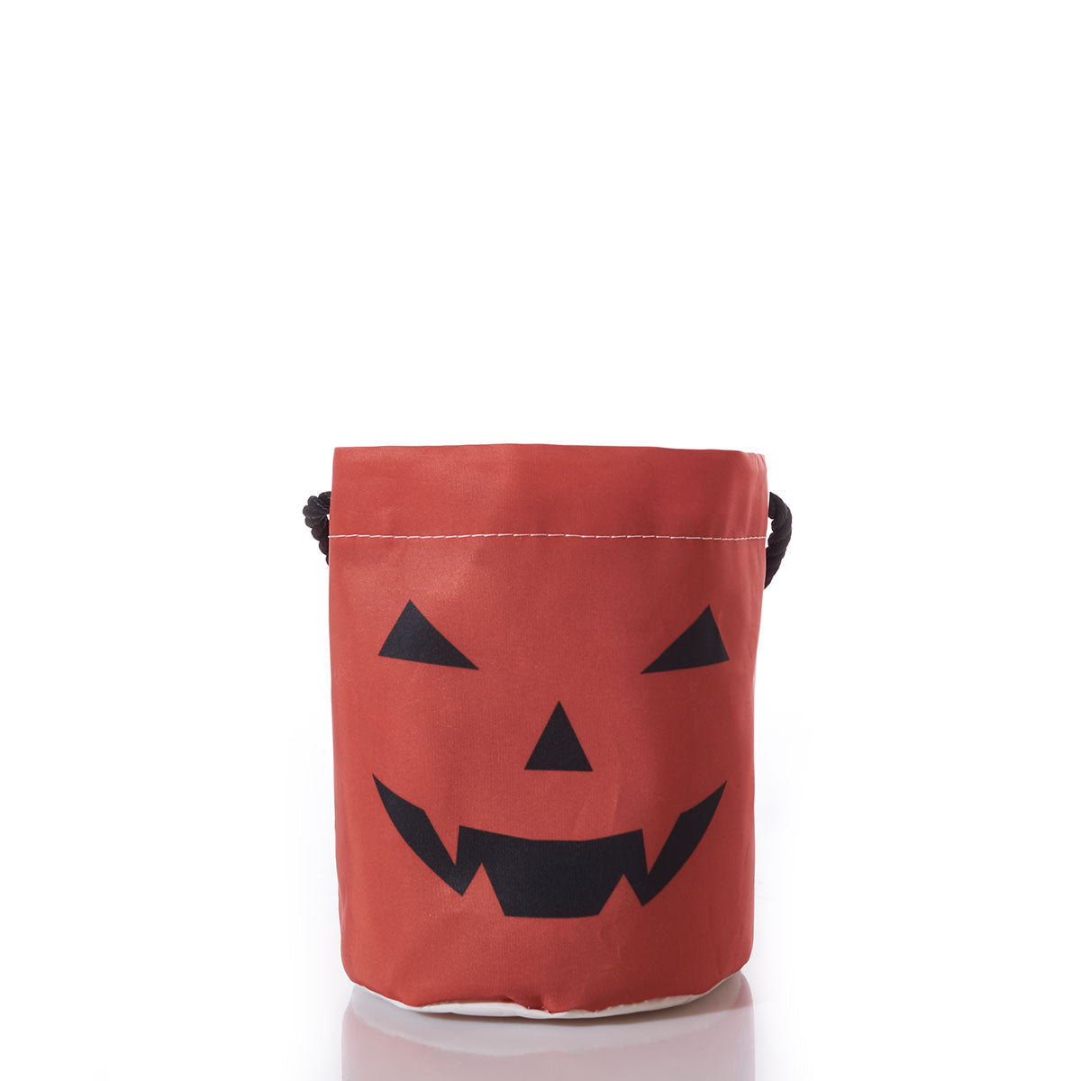The Sea Bags Jack OLantern Bucket Bag features orange fabric with a black jack-o-lantern face and sturdy black handles, making it perfect as a reusable candy bucket for trick-or-treating; shown here on a white surface with a white background. by Sea Bags