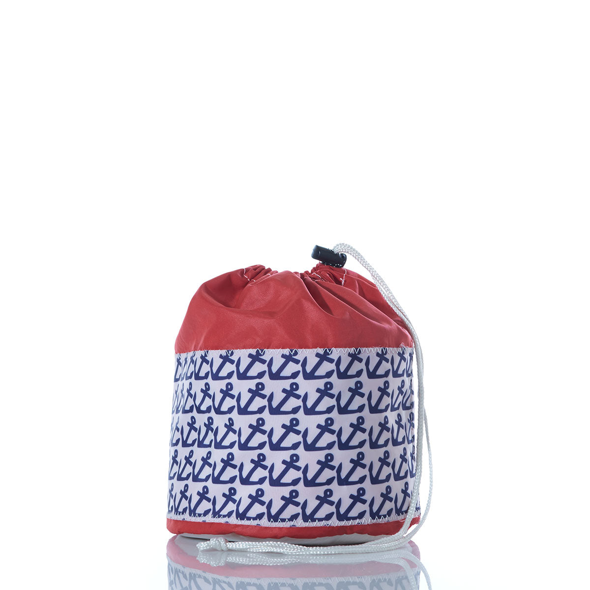 Sea Bags Anchor Pop Ditty Bag in red and white, featuring a blue anchor pattern on the front, shown against a white background with a subtle reflection beneath. by Sea Bags