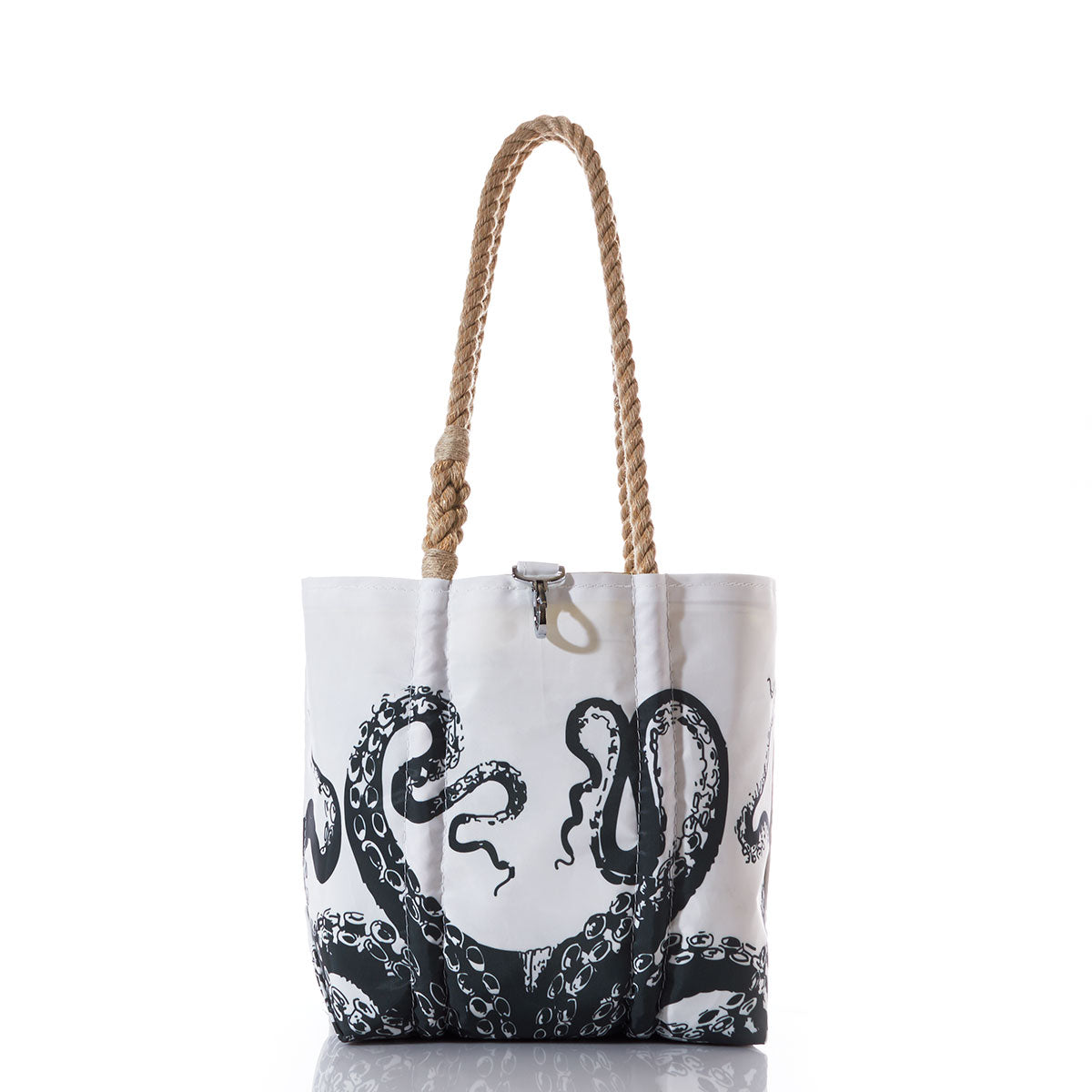 The Octopus Handbag by Sea Bags features a bold black octopus tentacle design on white recycled sail cloth, accented with thick rope handles. Inspired by the spirit of Charles Darwin, this striking tote is photographed against a white background. by Sea Bags