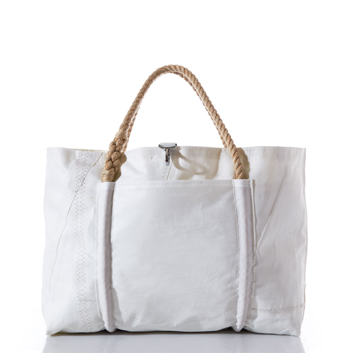 The Sea Bags Wharf Tote, featuring a white canvas design with a front pocket and durable twisted rope handles, is shown against a plain white background. by Sea Bags