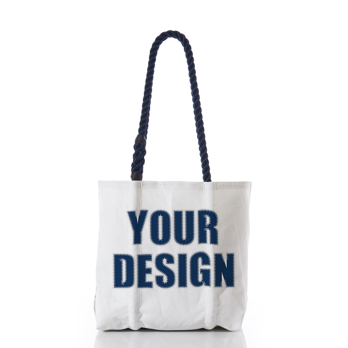 Sea Bags Custom Design Handbag with sturdy dark handles, shown standing upright, features bold navy text reading YOUR DESIGN on the front against a plain white backdrop—an ideal customizable tote for expressing your unique style. by Sea Bags