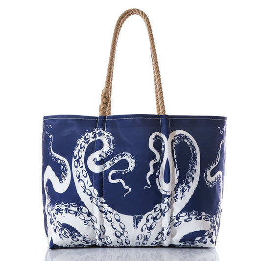 The Sea Bags Zip Top White on Navy Octopus Large Tote is crafted from recycled sail cloth, features hand-spliced rope handles, and showcases a bold white octopus tentacle print. by Sea Bags