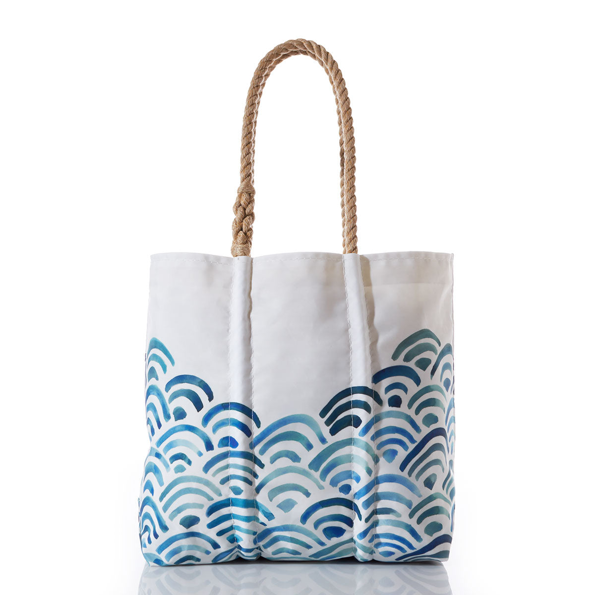 Sea Bags Watercolor Waves Tote with Clasp and Hanging Pocket, featuring a blue wave pattern on recycled sail cloth and two rope handles, offers a unique, reusable bag photographed on a white background. by Sea Bags