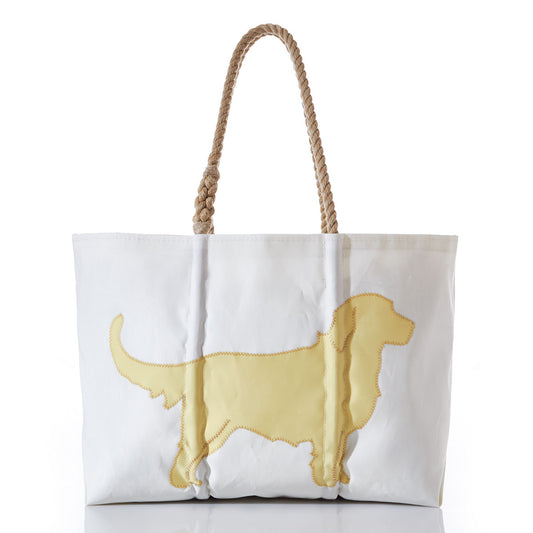 The Sea Bags Golden Retriever Large Tote is crafted from white recycled sail, featuring sturdy rope handles and a yellow stitched silhouette of a Golden Retriever on the front—making it the perfect accessory for dog lovers and their faithful companions. by Sea Bags