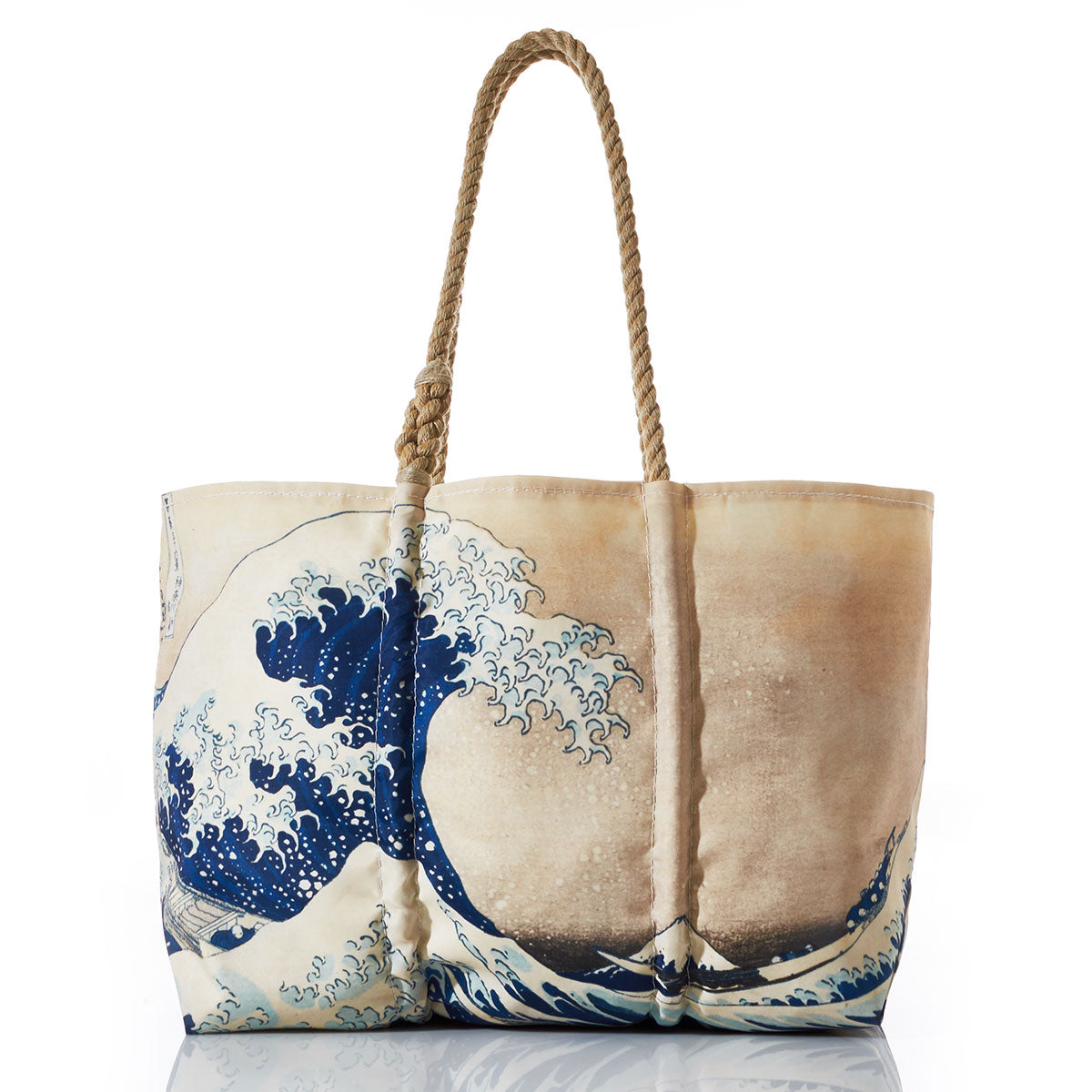 The Kanagawa Wave Tote by Sea Bags is a beige tote bag with rope handles, handcrafted in Maine from recycled sail cloth and featuring a striking blue and white print of The Great Wave off Kanagawa artwork. by Sea Bags