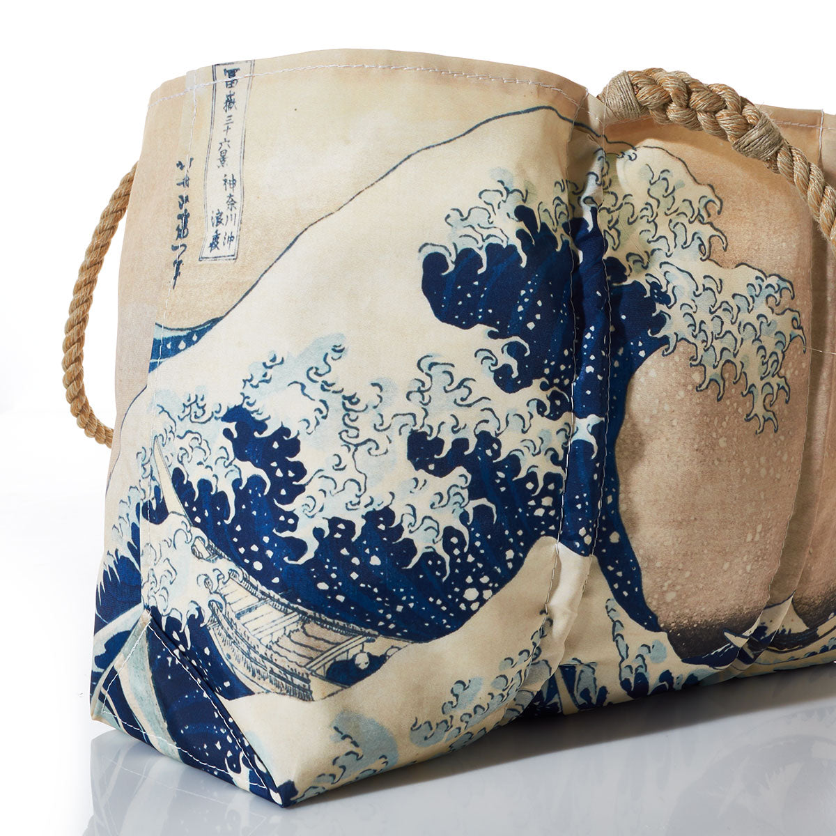 Introducing the Kanagawa Wave Tote by Sea Bags—a handcrafted Maine tote that combines coastal charm with classic style. Featuring sturdy rope handles and a printed design inspired by Hokusai’s The Great Wave off Kanagawa in elegant blue and beige tones, this tote captures the timeless artistry of Japan for everyday use. by Sea Bags