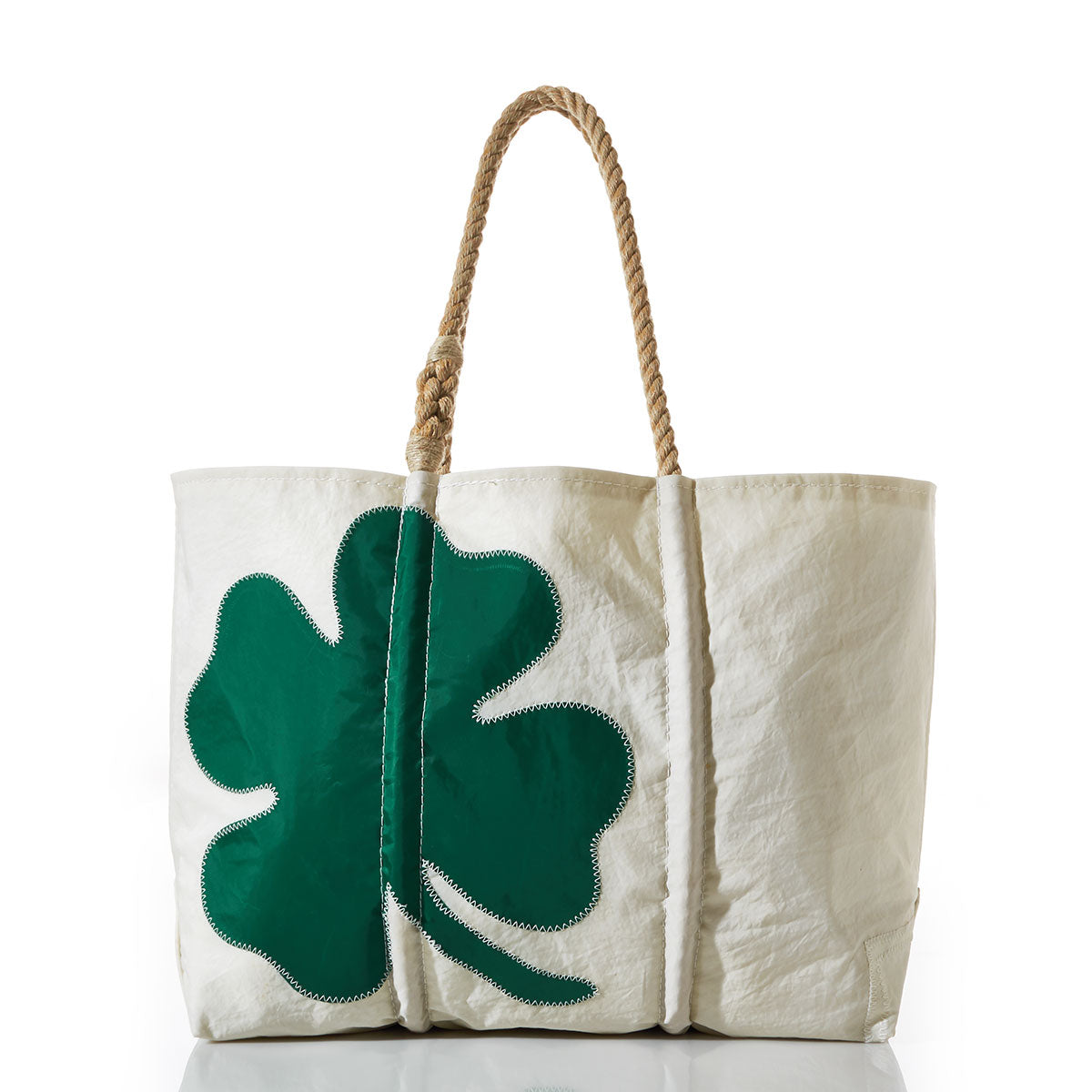 The Four Leaf Clover Large Tote by Sea Bags is crafted from white recycled sail cloth, featuring sturdy tan rope handles and a bold green four-leaf clover motif on the front—an ideal accessory for St. Patricks Day—shown here against a white background. by Sea Bags