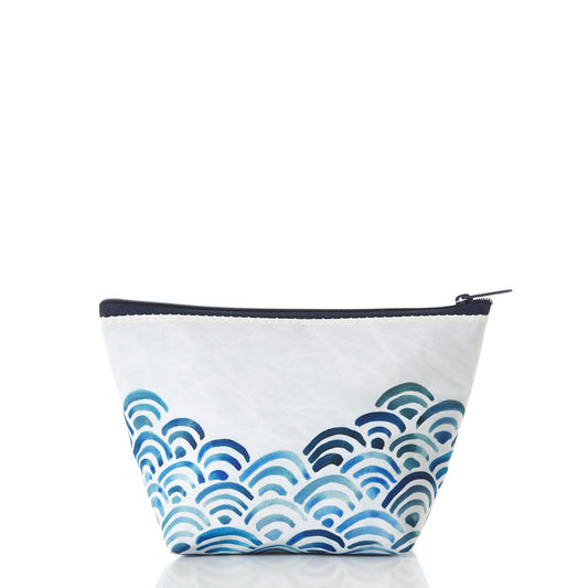 The Sea Bags Watercolor Waves Cosmetic Bag is a small white zippered pouch featuring a blue wave pattern at the bottom, crafted from recycled sailcloth for an eco-friendly touch—perfect as a cosmetic bag and ideal travel accessory; shown on a white background. by Sea Bags