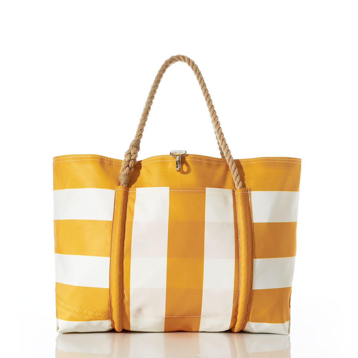 The Yellow Pier Tote by Sea Bags is a yellow and white striped bag with rope handles, made from recycled sail cloth and designed with a large exterior pocket. The tote stands upright on a white surface, set against a plain white background. by Sea Bags