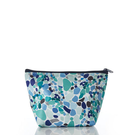 The Sea Bags Sea Glass Print Cosmetic Bag, featuring a unique blue, teal, and navy pebble pattern inspired by sea glass and finished with a zipper closure, is displayed from the front against a white background. by Sea Bags