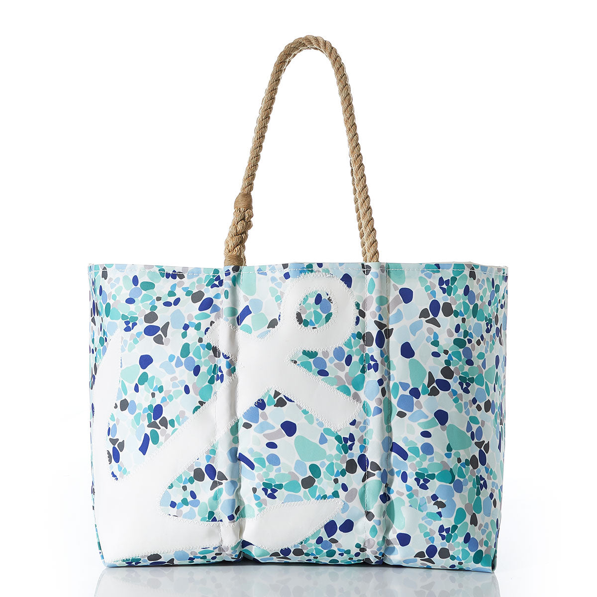 The Sea Bags White Anchor on Sea Glass Large Tote features a multicolored blue and green pebble pattern with a bold white anchor design, thick twisted tan rope handles, and is expertly crafted from recycled sail cloth. by Sea Bags