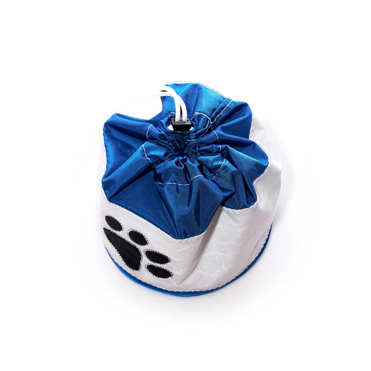 The Paw Print Ditty Bag by Sea Bags features a blue and white drawstring design with a black paw print motif, crafted from recycled sail bags and shown against a white background. by Sea Bags