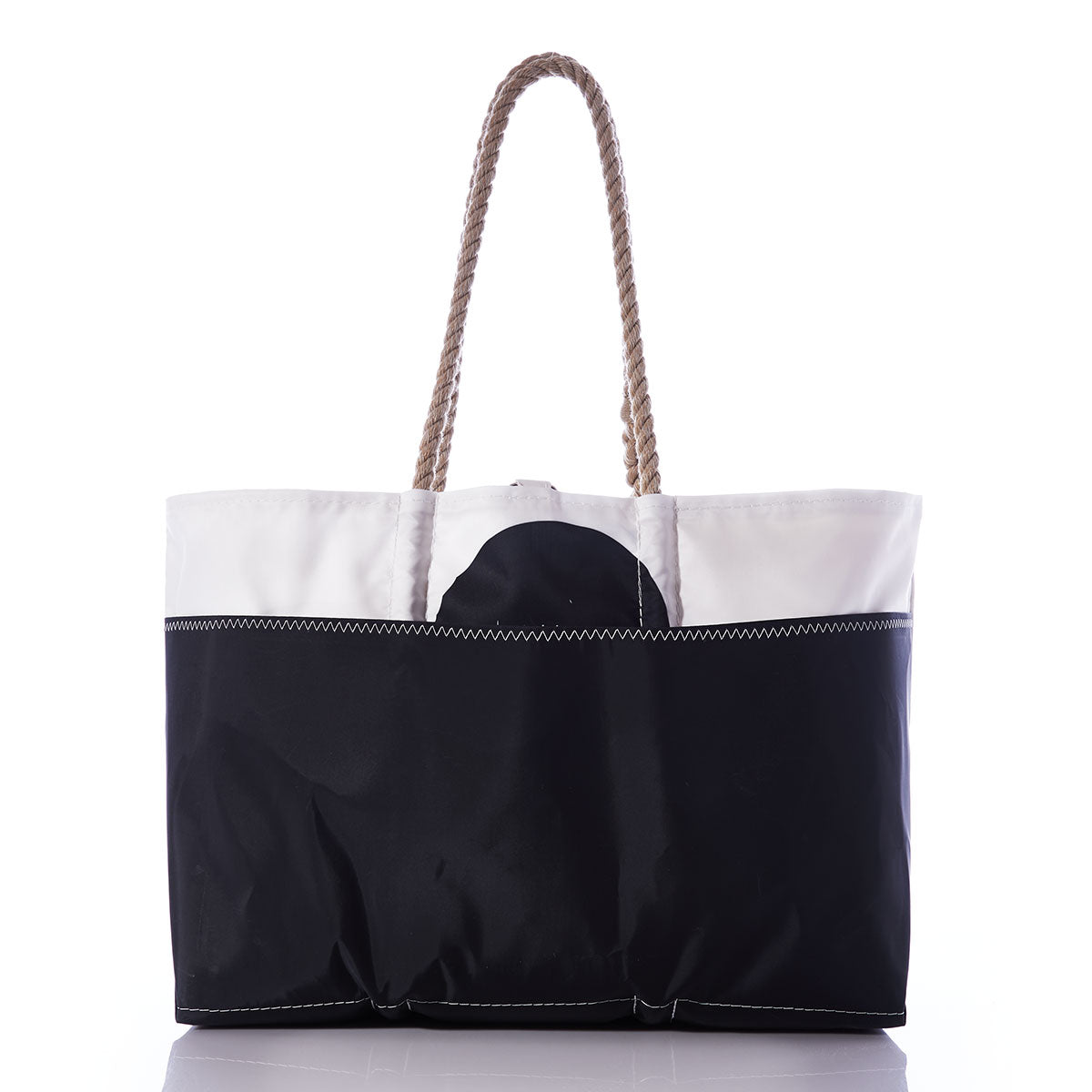 The Octopus Ogunquit Beach Tote by Sea Bags is crafted from recycled sail cloth and features sturdy rope handles, a striking black semicircle design reminiscent of a vintage illustration, and visible white stitching; it is photographed on a white background. by Sea Bags