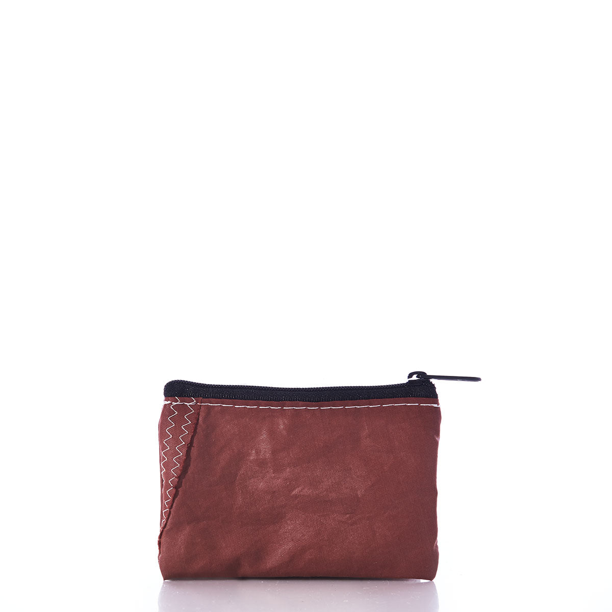 The Tanbark Everyday Carry Mini Pouch by Sea Bags is a small brown pouch crafted from recycled tanbark sail fabric, featuring a black zipper and distinct white stitching on one side, photographed against a plain white background—a subtle nod to sailing history. by Sea Bags