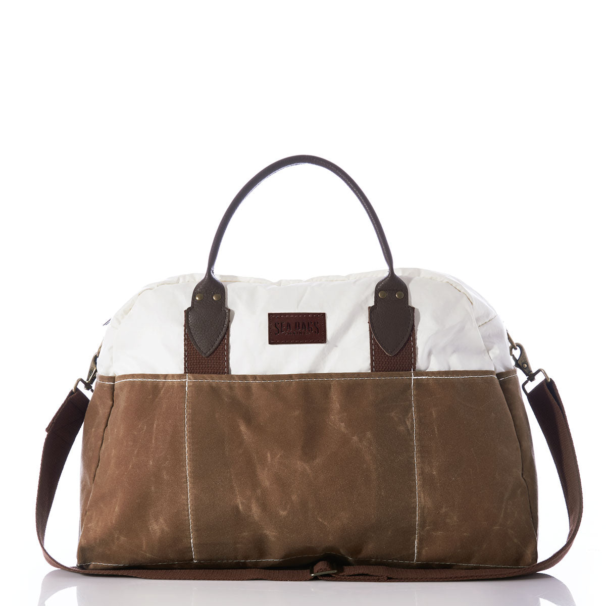 Introducing the Tan Chebeague Weekender by Sea Bags—a two-tone duffel bag made from recycled sail cloth, featuring a white top, tan bottom, dark brown handles, and an adjustable shoulder strap, shown against a white background. by Sea Bags
