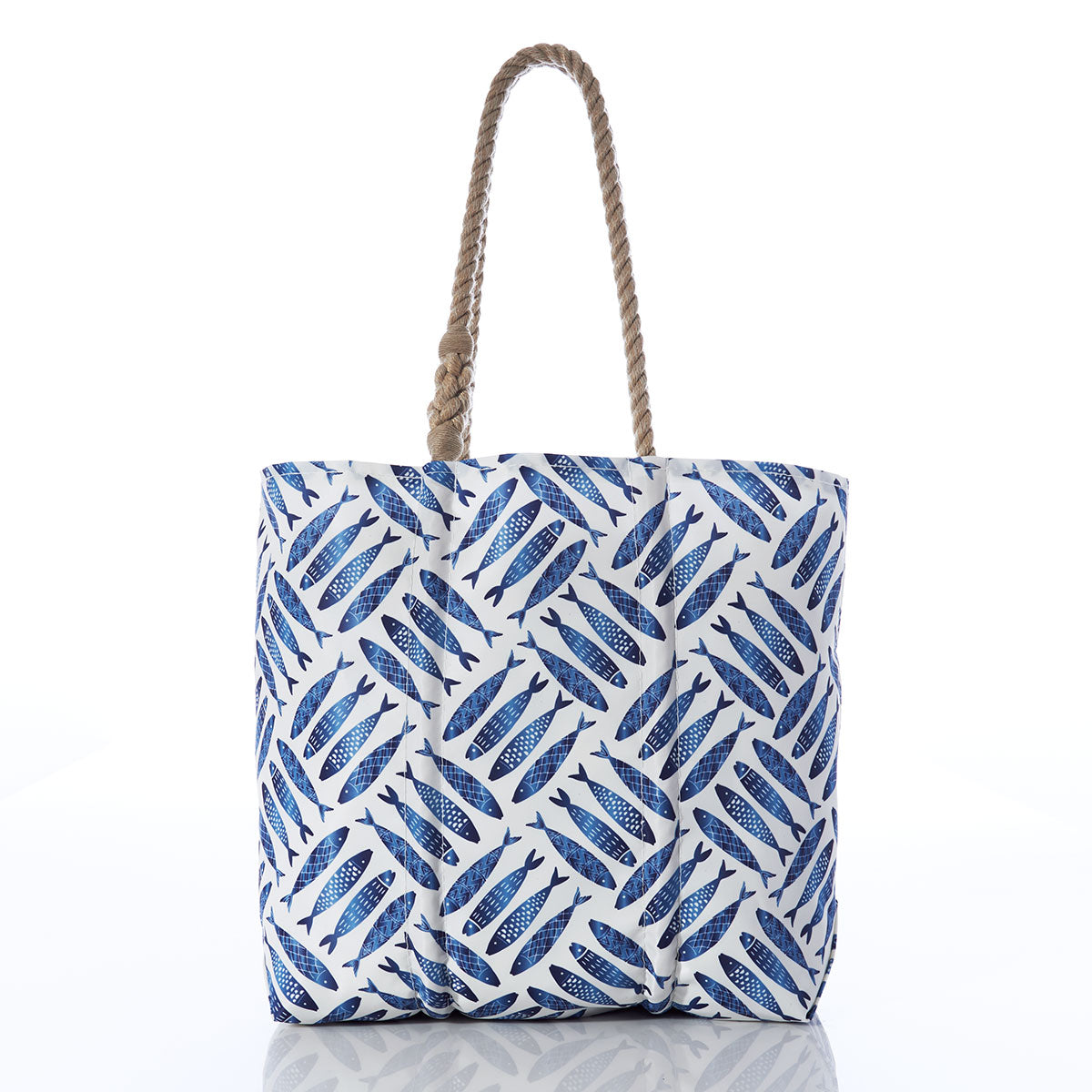 The Sea Bags Fish Print Medium Tote with Clasp features a blue fish pattern and two twisted rope handles, crafted from weather-resistant recycled sails. Shown against a plain white background, this eco-friendly tote is perfect for nautical adventures at the beach. by Sea Bags