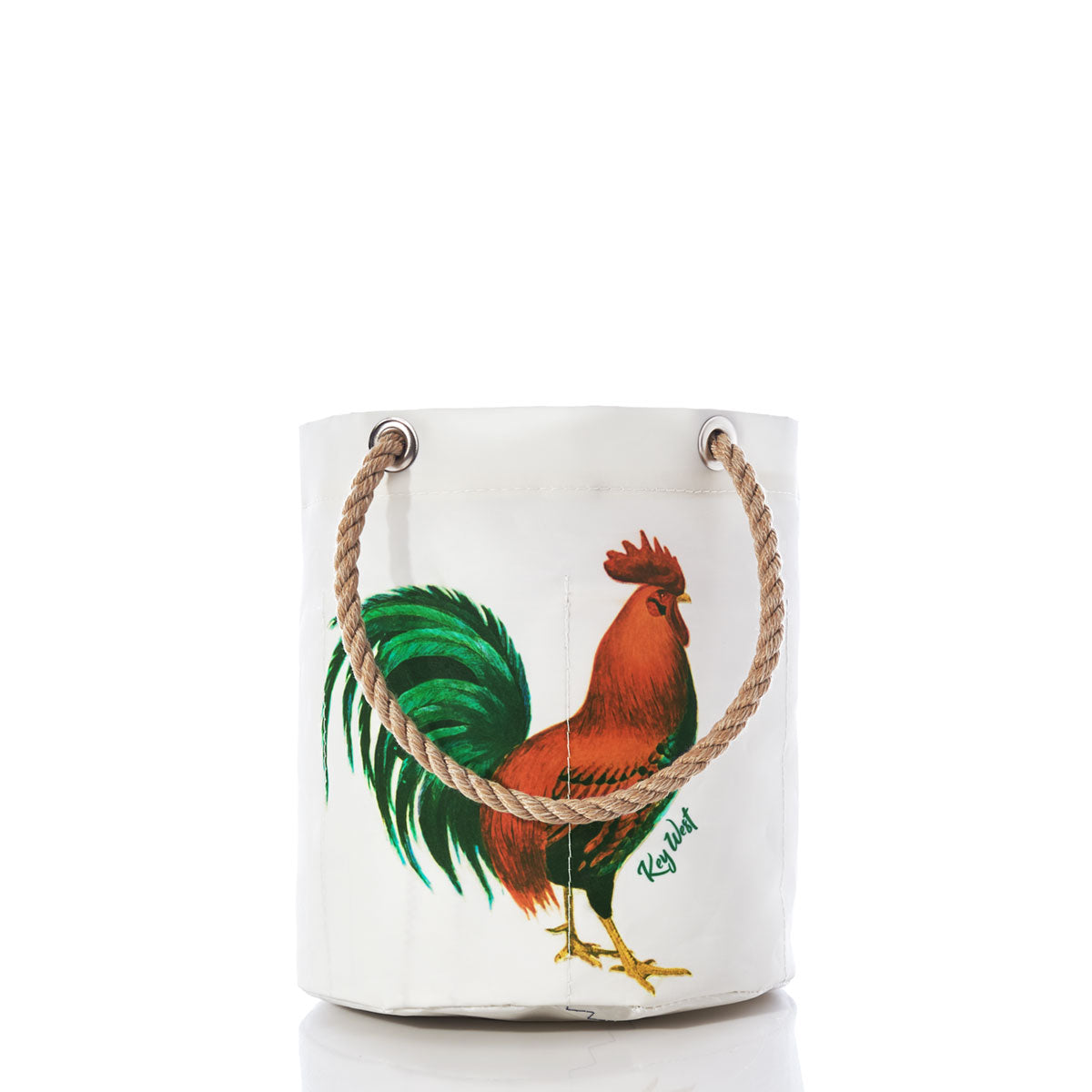 The Sea Bags Key West Rooster Beverage Bucket is a white bucket bag made from recycled sail cloth, featuring rope handles and a painted rooster with green and brown feathers on the front. Inspired by the spirit of a Key West beverage bucket, this eco-friendly accessory blends coastal charm with practical style. by Sea Bags