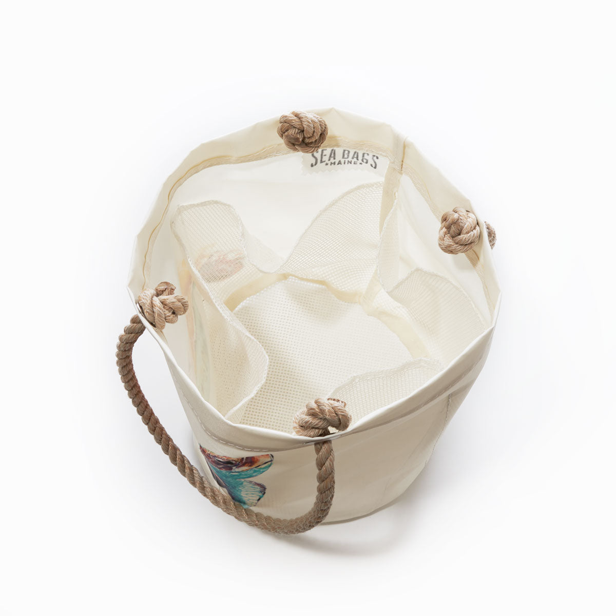 Multicolor Sea Turtle Beachcomber Bucket by Sea Bags, crafted from recycled sails with canvas and mesh construction, rope handles featuring nautical knots, viewed from above on a white background. by Sea Bags