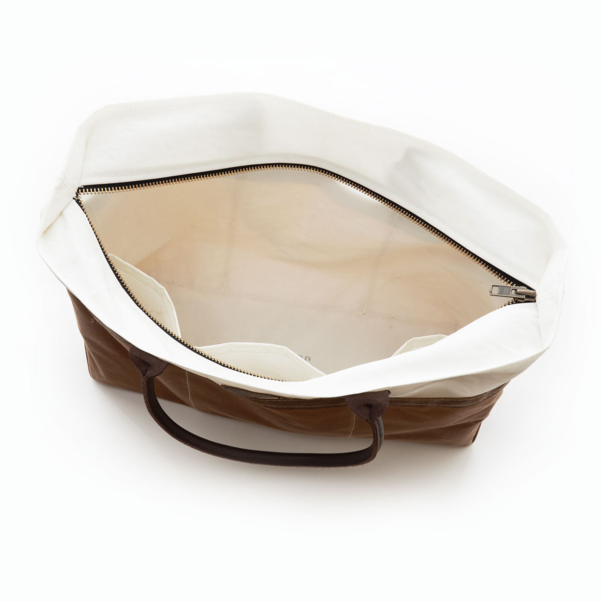 Open view of the Tan Chebeague Large Travel Tote by Sea Bags, crafted from recycled sail cloth in brown and white, featuring black handles, a zippered inner pocket, two open inner pockets—perfect as a stylish and functional travel bag. by Sea Bags