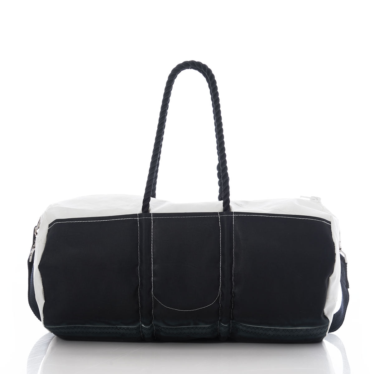 The Sea Bags Jolly Roger Duffel, featuring black and white rope handles and durable duffel bag construction, is displayed on a reflective surface with a white background. by Sea Bags