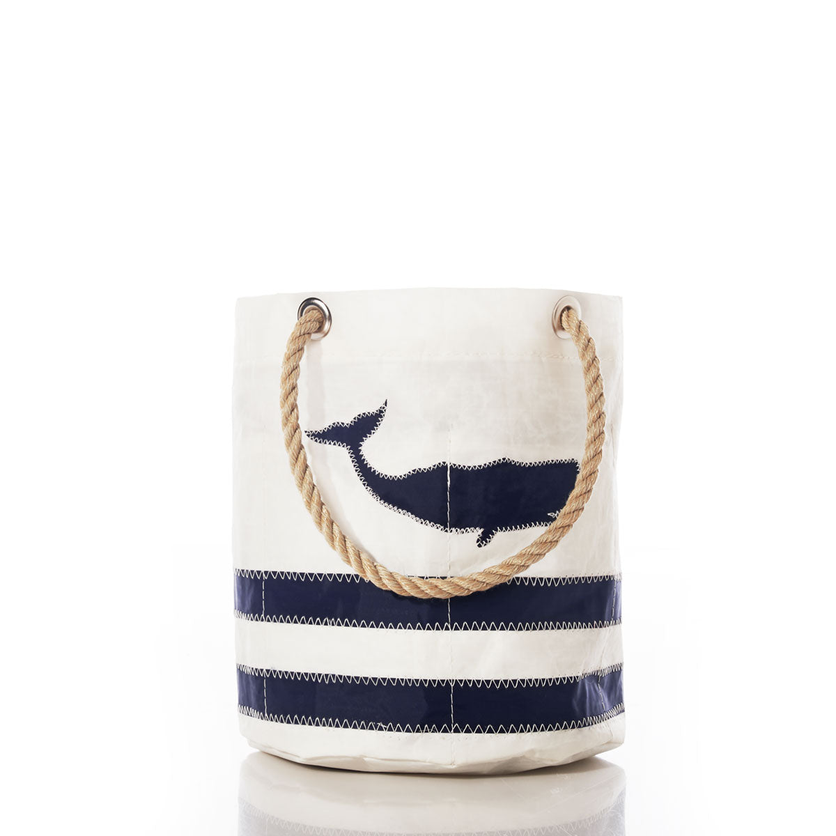 Introducing the Breton Stripe Whale Beverage Bucket by Sea Bags—an eco-friendly cooler featuring a white canvas design with rope handles, signature navy blue whale graphic, and classic navy blue horizontal stripes at the base, inspired by nautical style. by Sea Bags