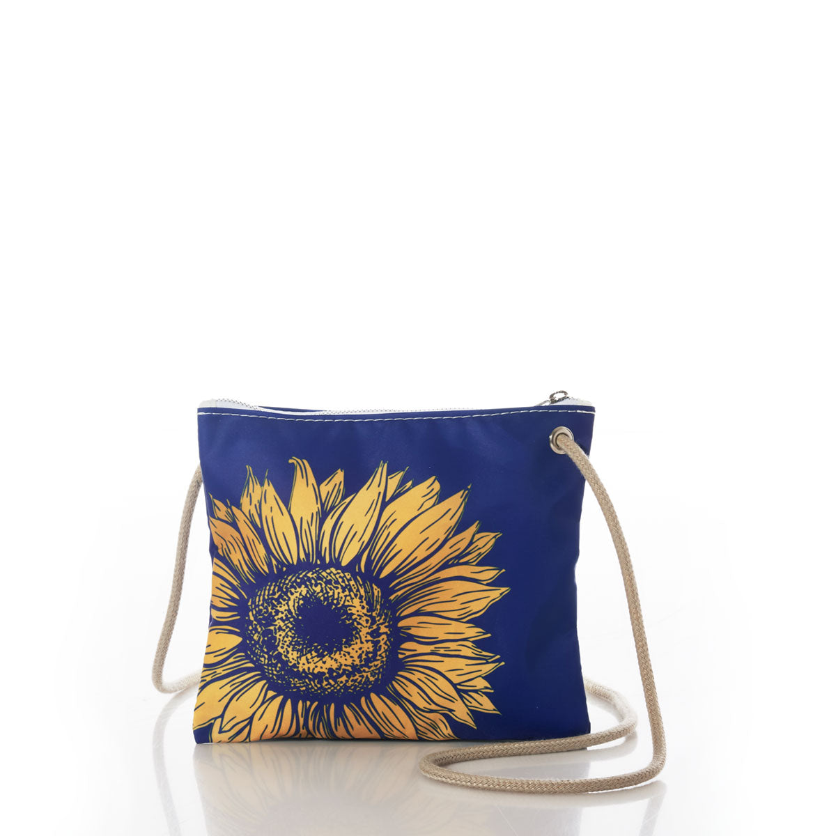 The Sea Bags Sunflower Slim Crossbody features a small blue design adorned with a yellow sunflower graphic, complemented by a beige rope strap and secure zipper closure. Ideal for nature lovers or anyone looking for a minimalist accessory, this bag is shown on a white background with its reflection visible underneath. by Sea Bags