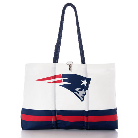 Introducing the New England Patriots Tailgate Tote by Sea Bags—a white recycled sail cloth tote featuring navy handles, bold red and navy horizontal stripes near the bottom, and the iconic New England Patriots logo. This stylish Patriots tote is perfect for game days or everyday errands. by Sea Bags
