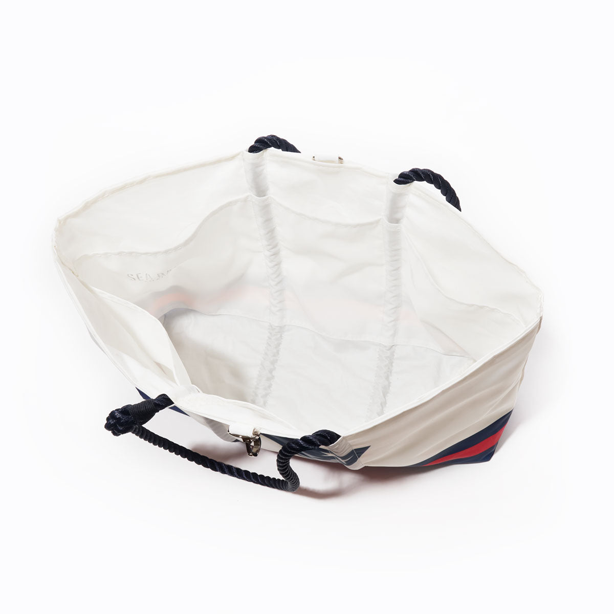 Sea Bags New England Patriots Tailgate Tote is a white bag with navy rope handles, crafted from recycled sail cloth and shown open to reveal its spacious, unlined interior, photographed against a plain white background—an ideal companion for any outing. by Sea Bags