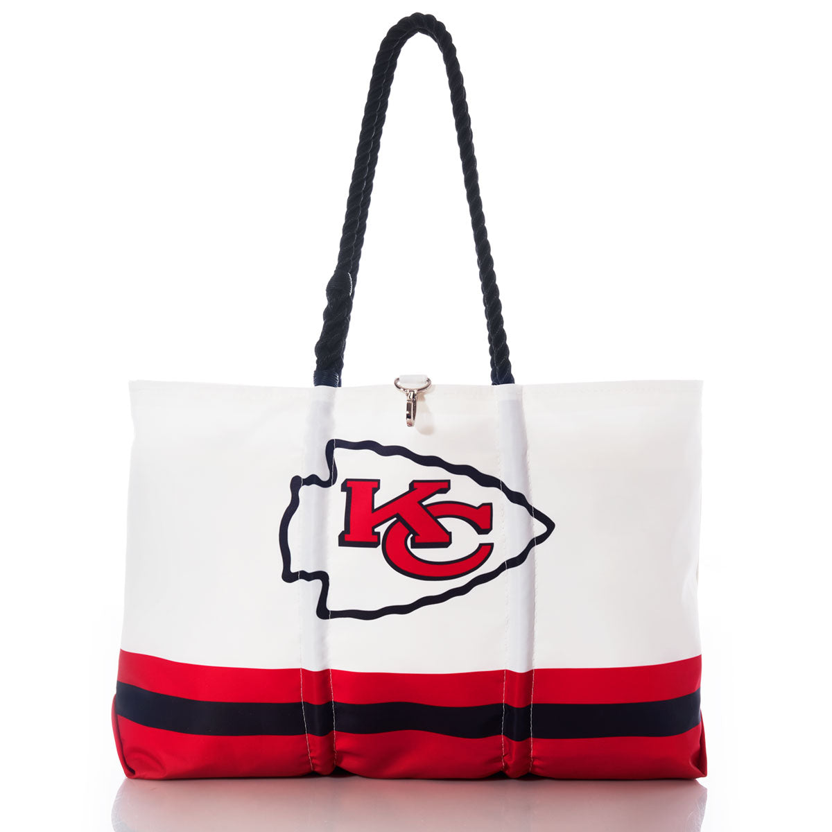 The Kansas City Chiefs Tailgate Tote by Sea Bags is a white tote bag featuring the team logo, black rope handles, and red and black stripes near the bottom. Crafted from recycled sail cloth for durability and sustainability, this eco-friendly tote is photographed on a white background. by Sea Bags